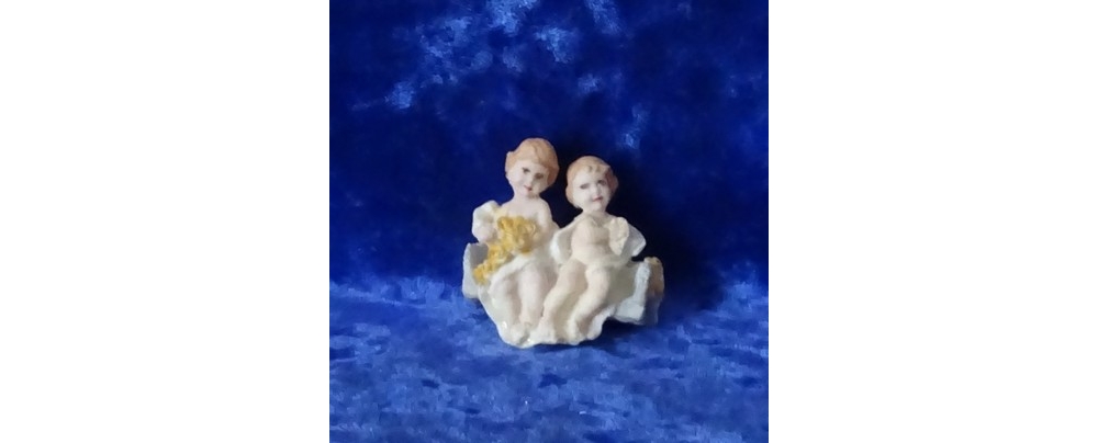 cherubs on a swing seat painted yellow